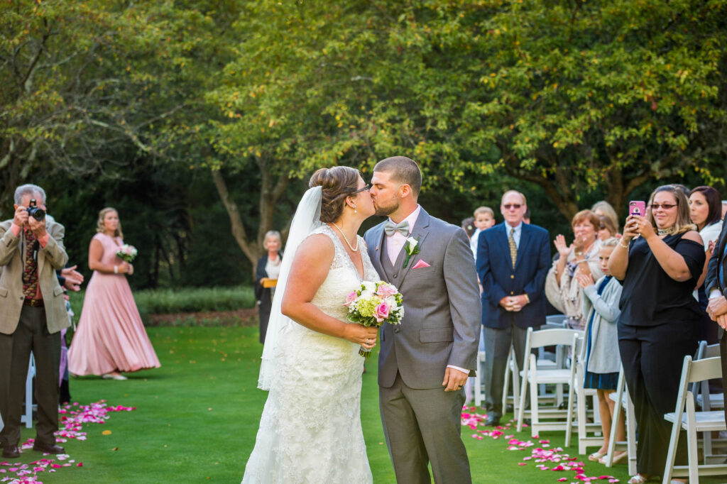 A joyful ceremony recessional at Brantwyn Estate in Wilmington, Delaware, as the newly married couple walks back down the aisle surrounded by family and friends.
