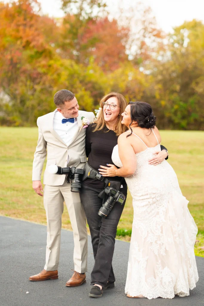 Nicole with bride and groom candid photo