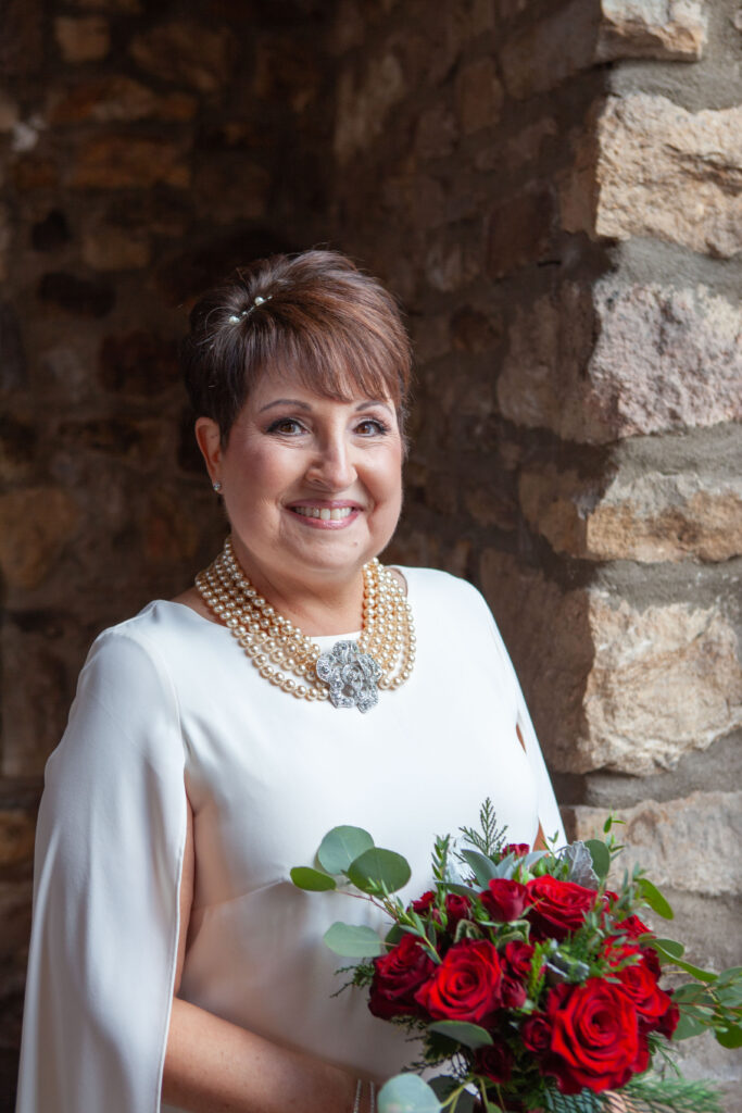 Soft window light inside Holly Hedge Estate creates timeless bridal portraits during the getting-ready portion of the wedding day.