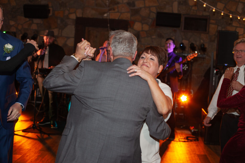 Guests celebrate and dance during a lively wedding reception at Holly Hedge Estate in New Hope, Pennsylvania.